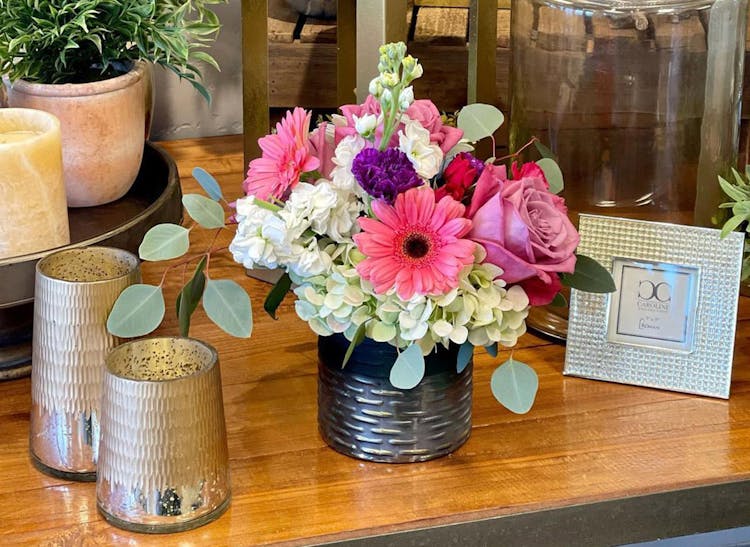 A bouquet of pink, purple and white flower on display in our Salinas showroom