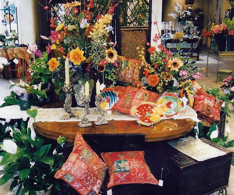 Various accessories and home furnishings, accented by a number of sunflower bouquets